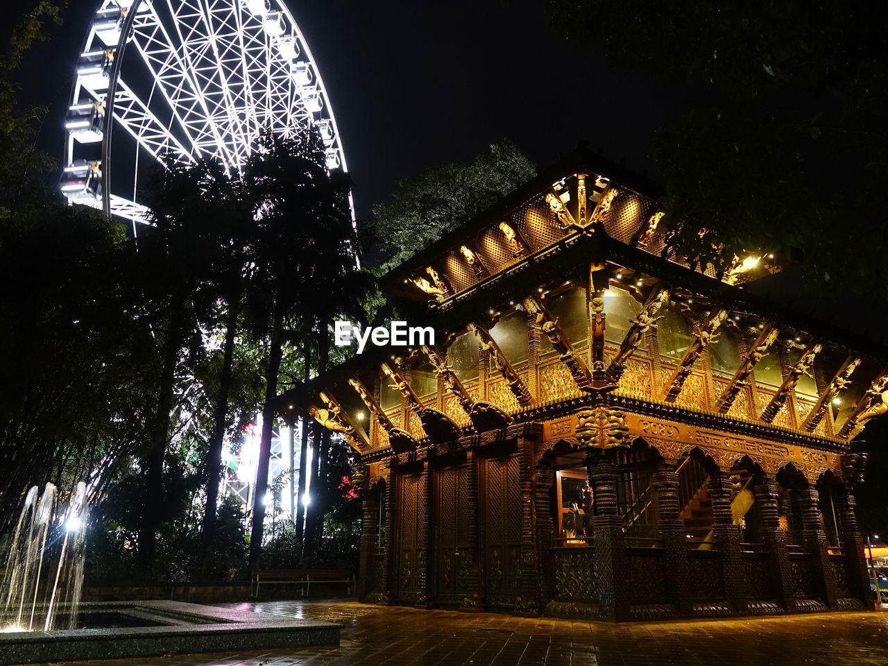 Low angle view of illuminated building at night