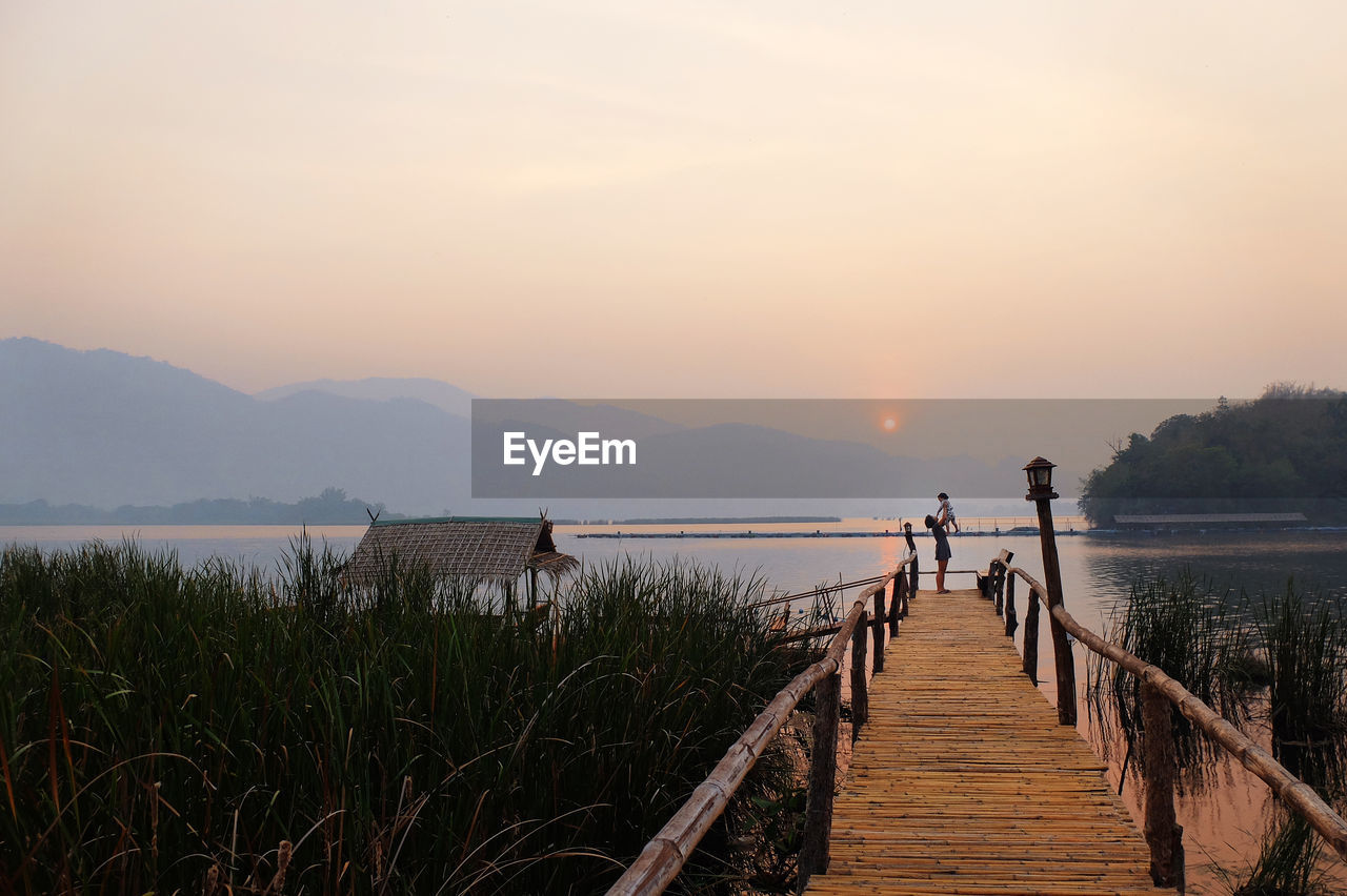 Scenic view of pier against sky during sunset