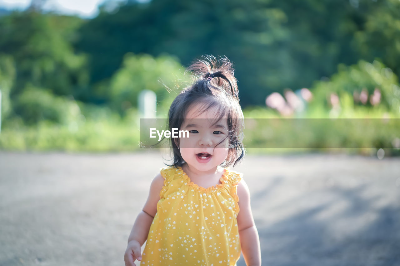 Portrait of cute girl standing outdoors