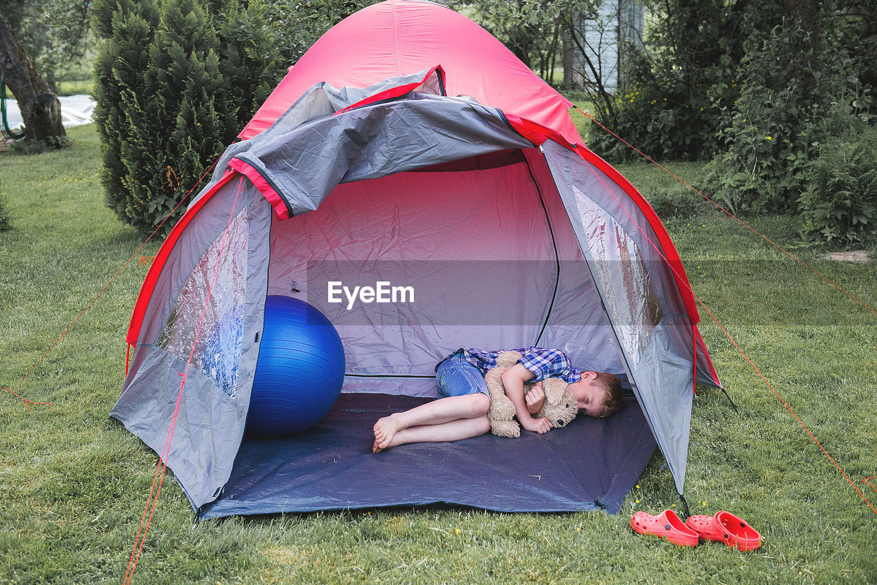 Child sleeping in a tent