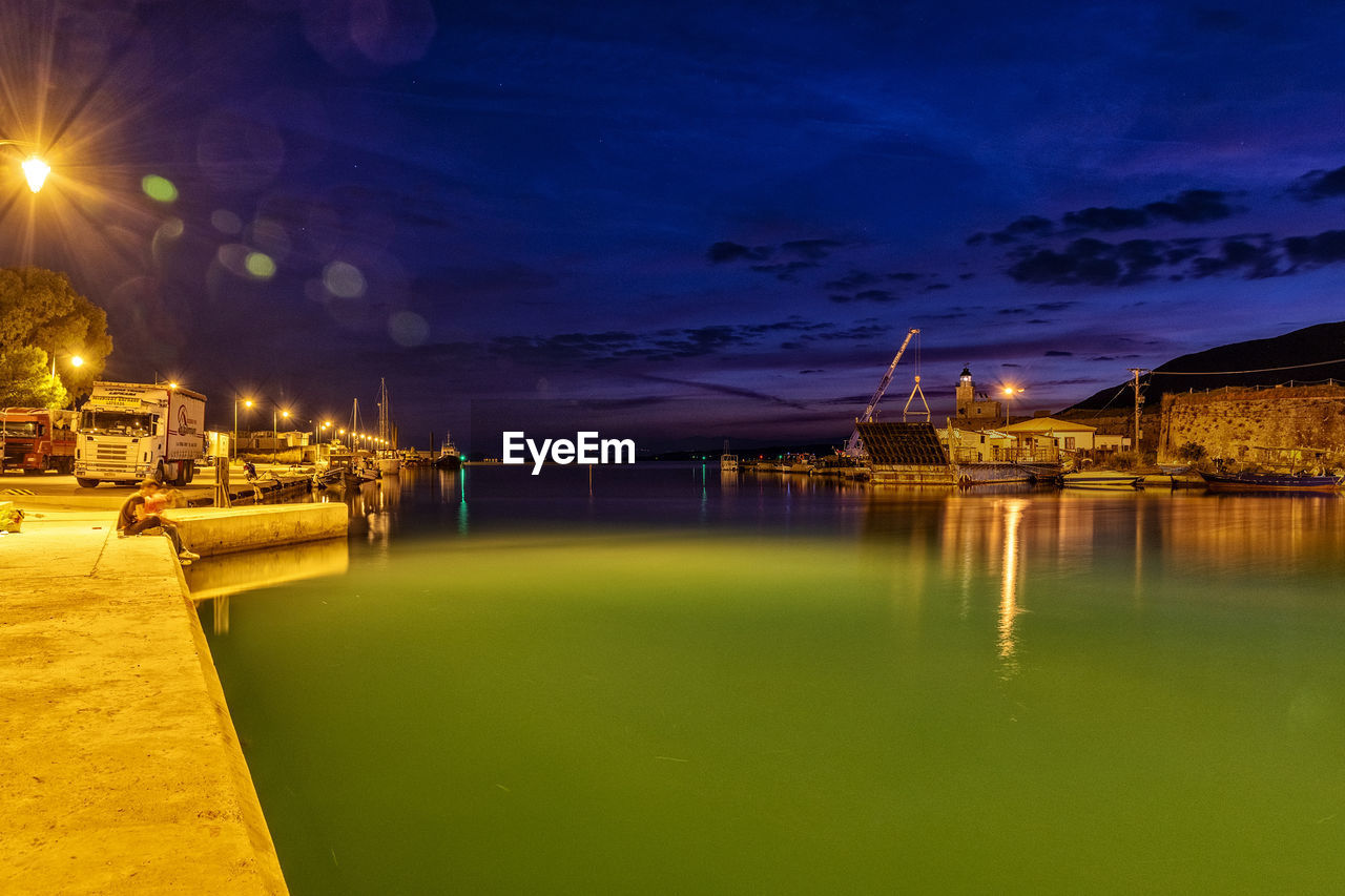 Illuminated buildings at waterfront