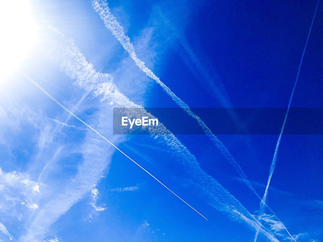 Low angle view of vapor trails in sky