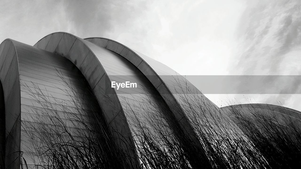 Low angle view of kauffman center against sky