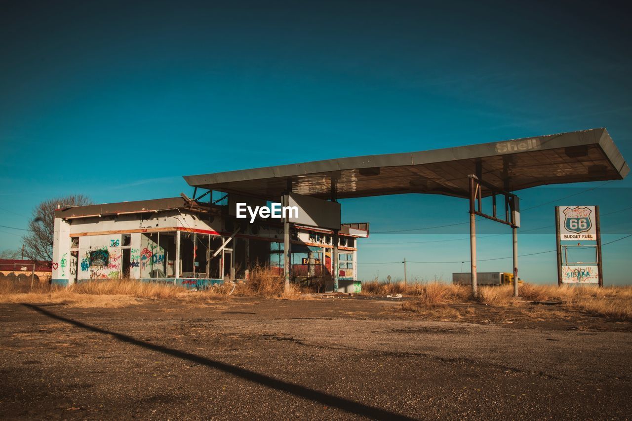 Abandoned building against blue sky