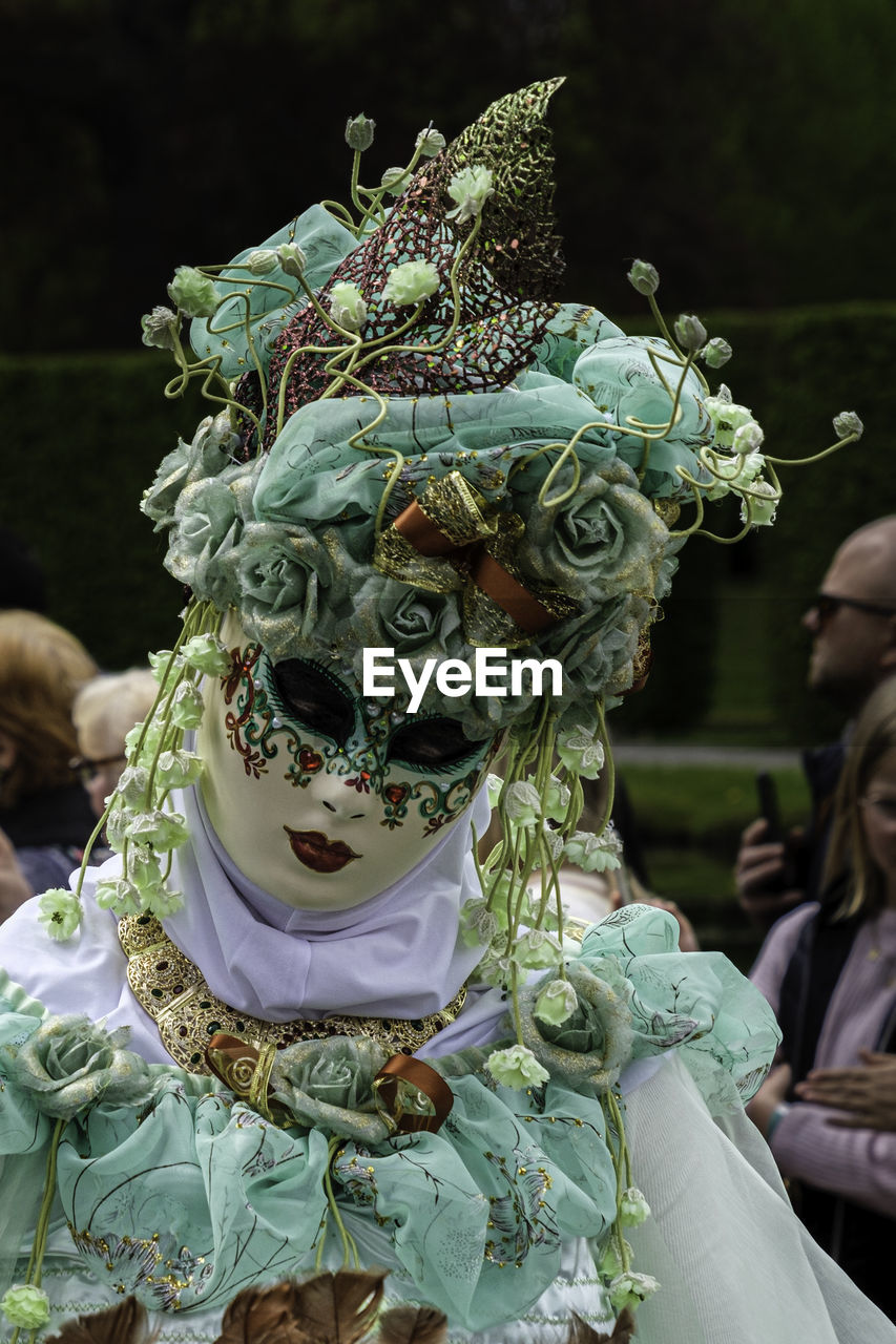 clothing, celebration, tradition, carnival, event, arts culture and entertainment, disguise, costume, mask - disguise, adult, mask, men, traditional clothing, women, festival, group of people, ceremony, day, outdoors, performance, representation, person, human face, dancing