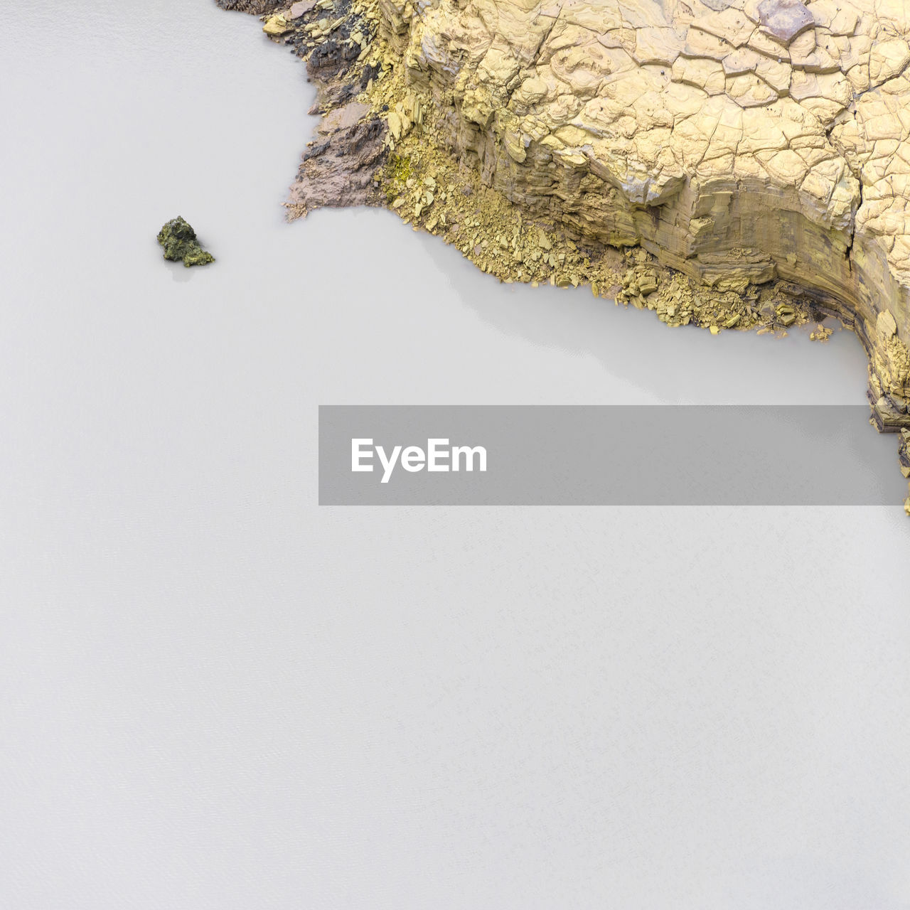 Aerial view of rock formation in lake