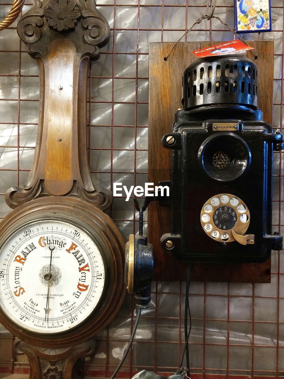 CLOSE-UP OF CLOCK ON METAL STRUCTURE