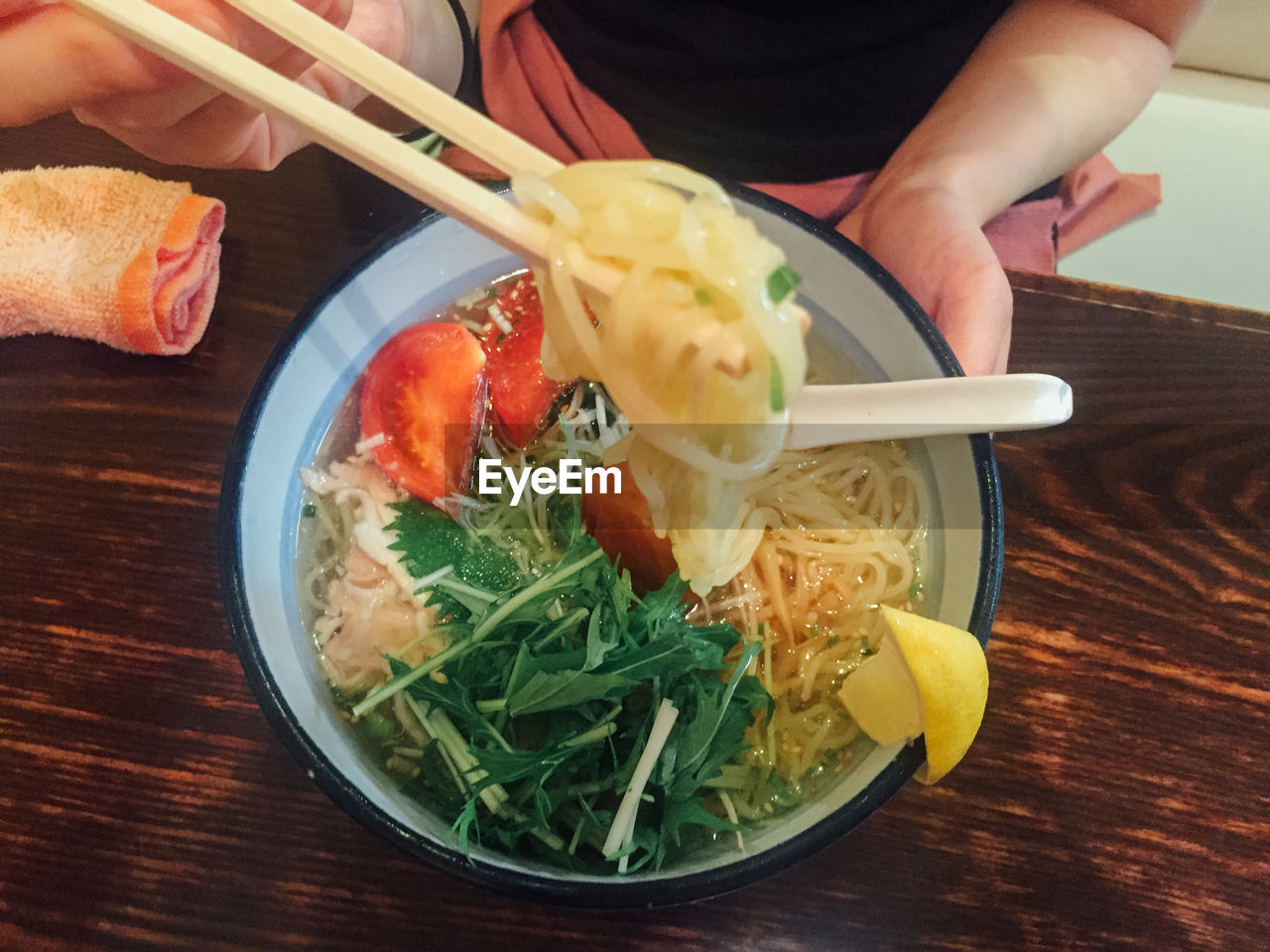 Close-up of woman eating ramen noodles in japan