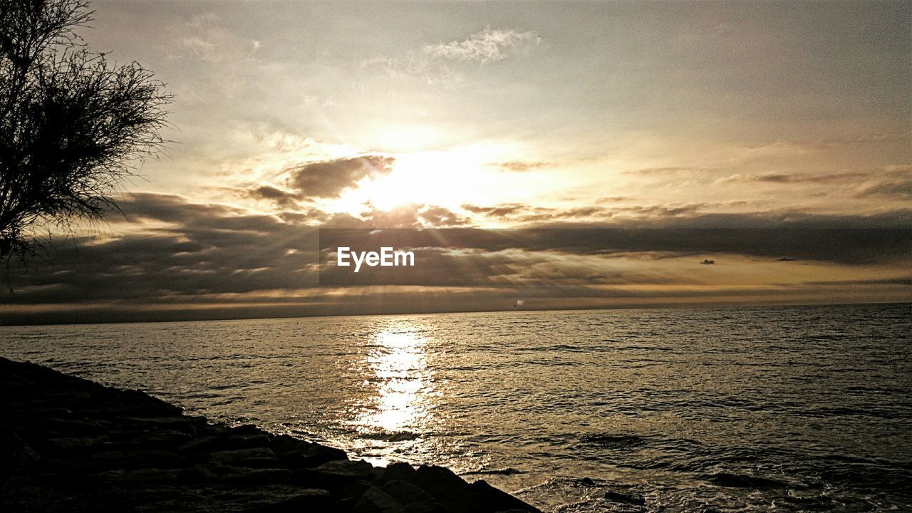 Scenic view of sea at sunset