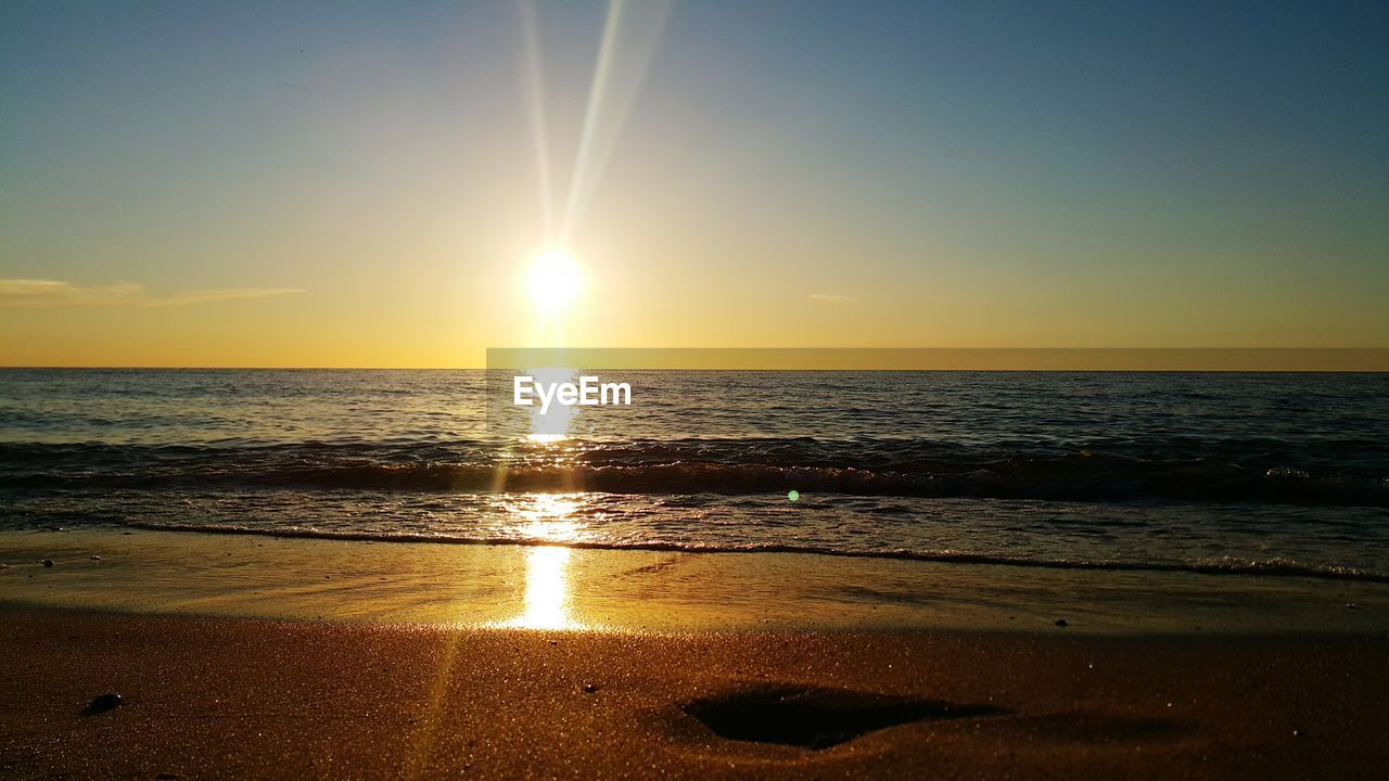 Scenic view of sea against sky during sunset