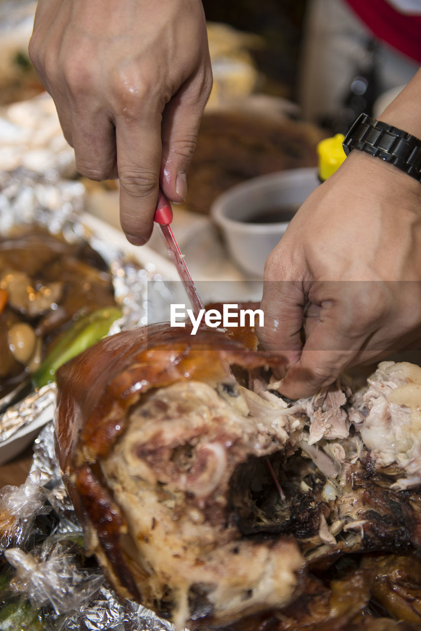 Close-up of man preparing food