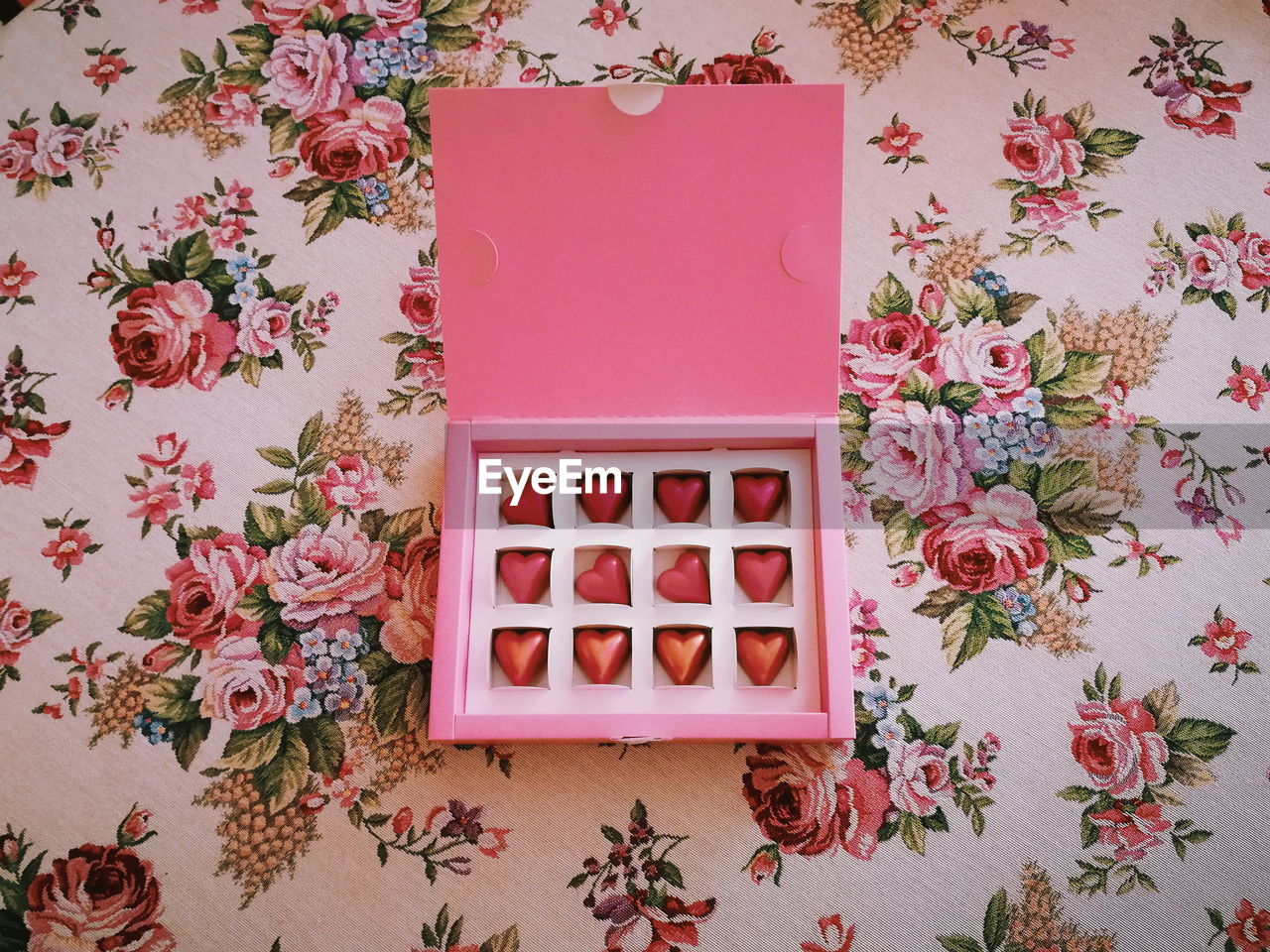 Directly above shot of pink chocolates on table at home