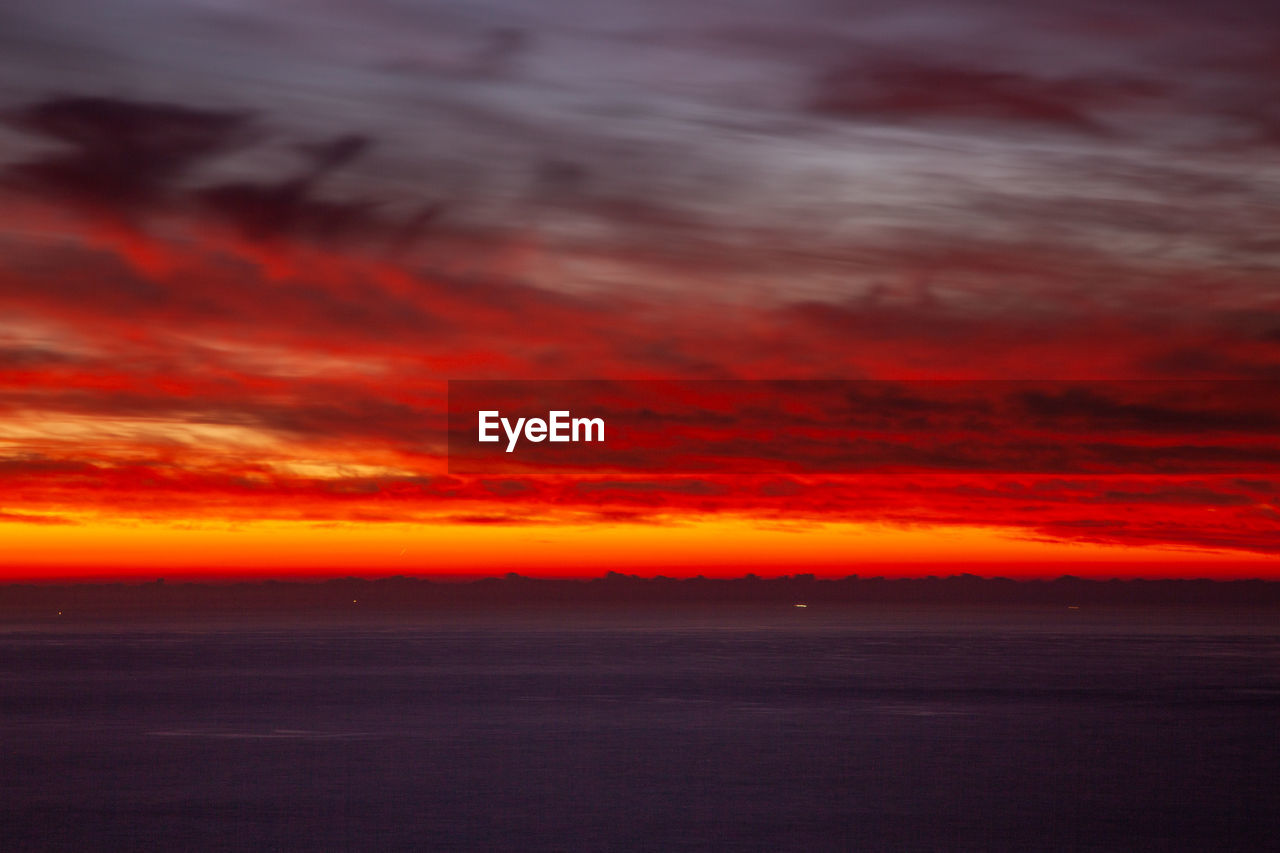 SCENIC VIEW OF DRAMATIC SKY DURING SUNSET