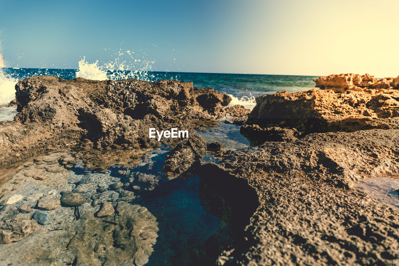 Scenic view of sea against clear blue sky