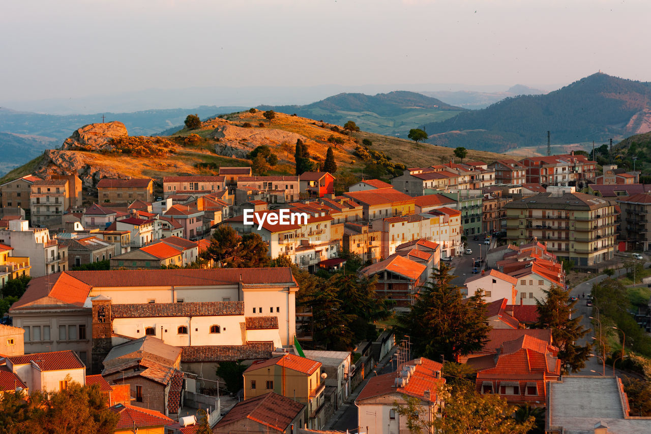 Landscape of small sicilian village located under the hill.