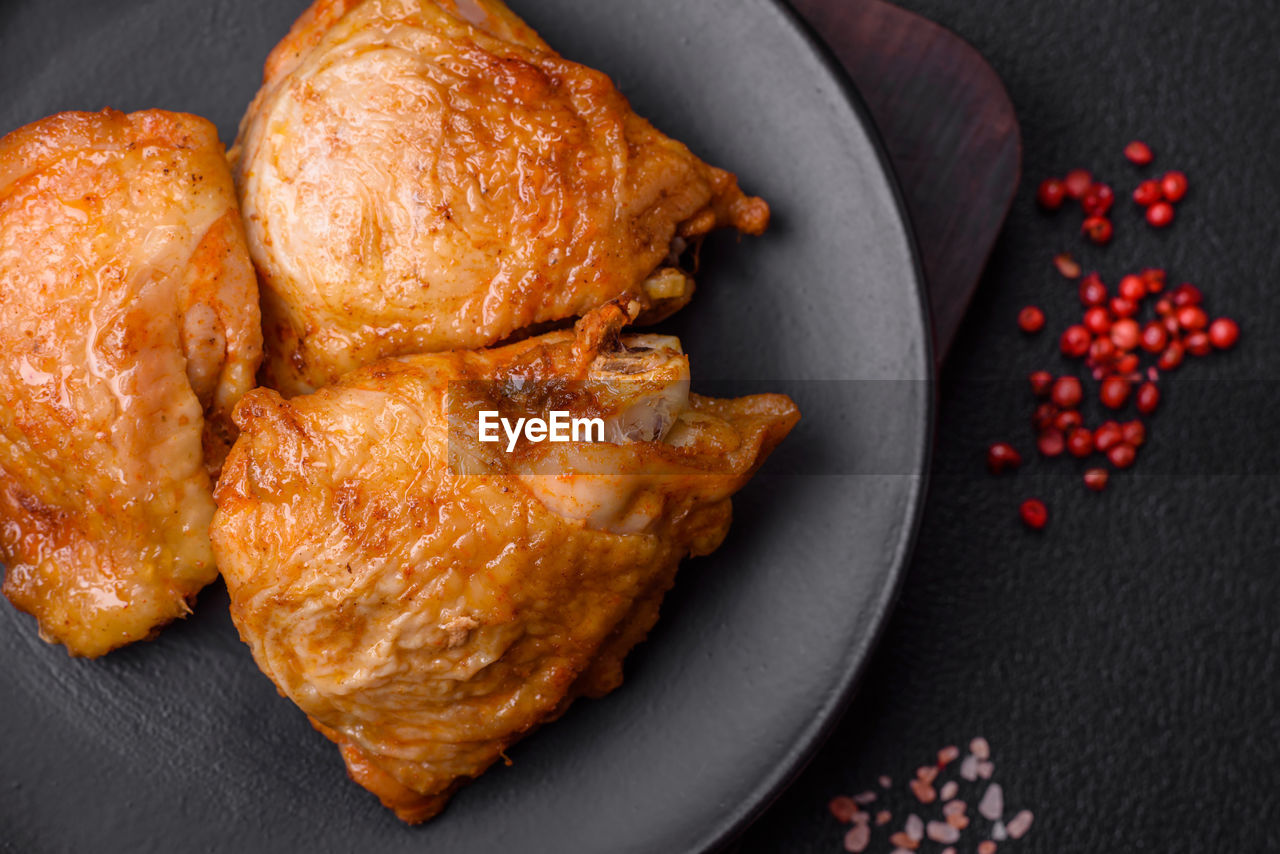 food and drink, food, dish, fried food, studio shot, meat, freshness, no people, roasted, black background, chicken, healthy eating, produce, meal, indoors, chicken meat, high angle view, wellbeing, still life, spice, cuisine, directly above, close-up, fruit