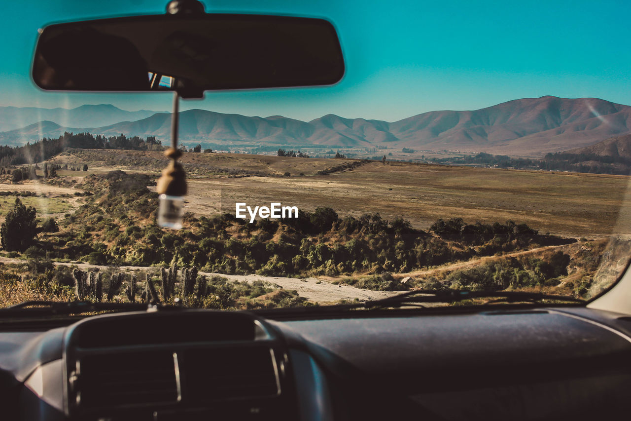 Landscape seen through car windshield