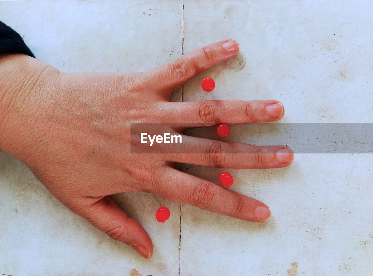 CLOSE-UP OF HAND TOUCHING BABY