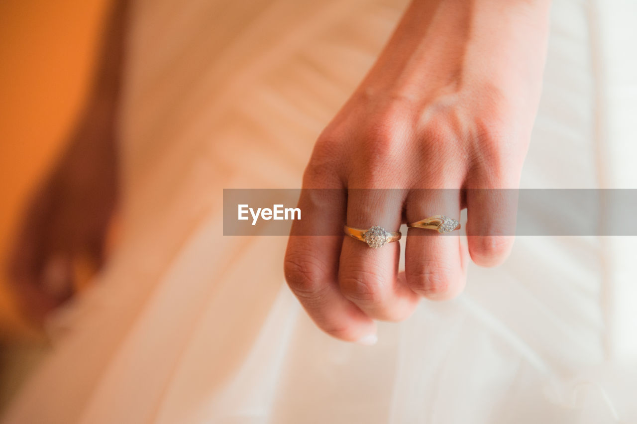 Cropped hand of woman wearing rings