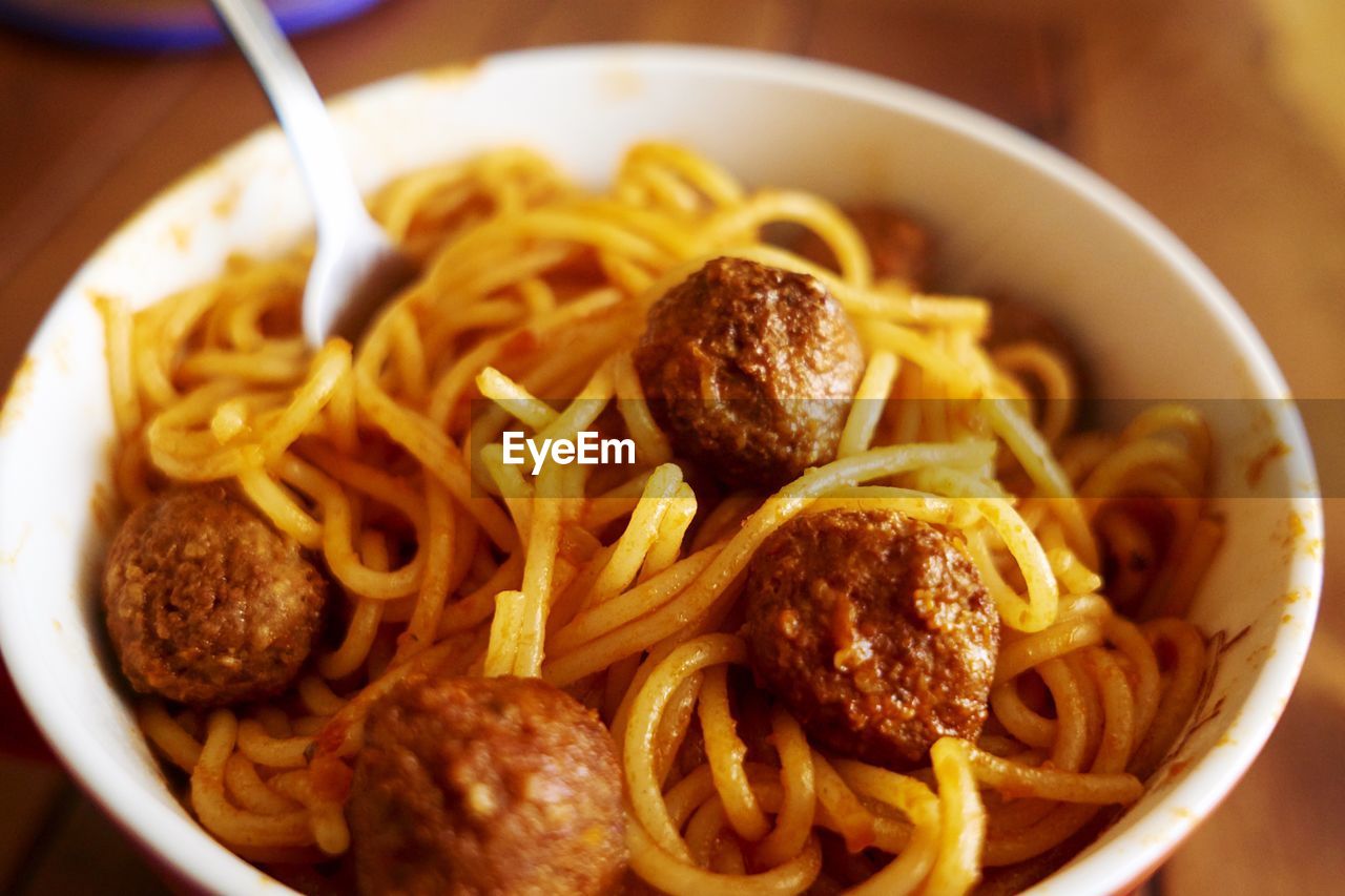 Close-up of meatballs with noodles served in bowl on table