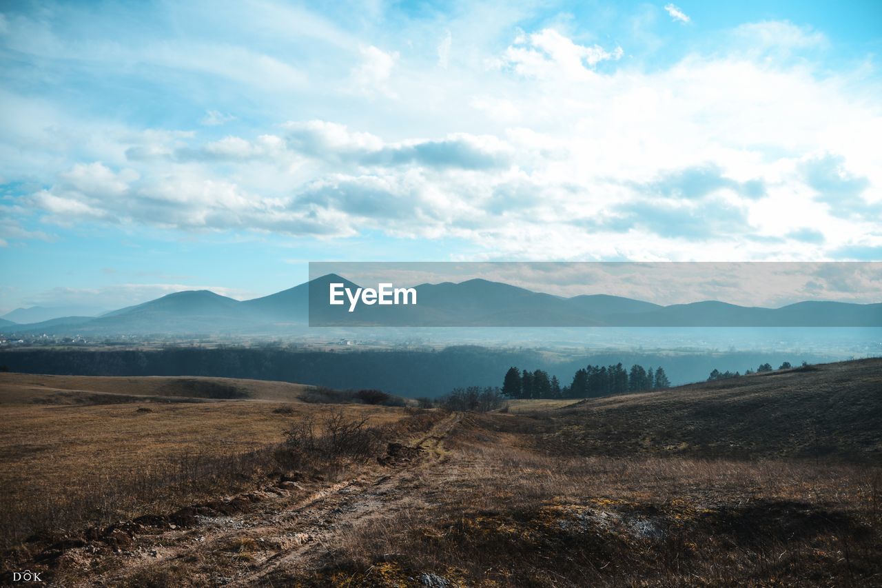 SCENIC VIEW OF LAND AGAINST SKY