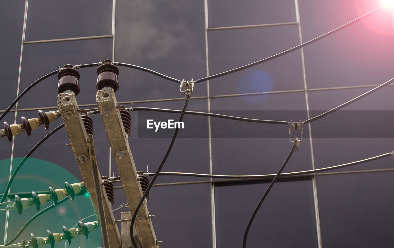 electricity, line, sky, no people, power generation, nature, technology, architecture, light, built structure, outdoors, mast, low angle view, electrical supply, metal, lighting