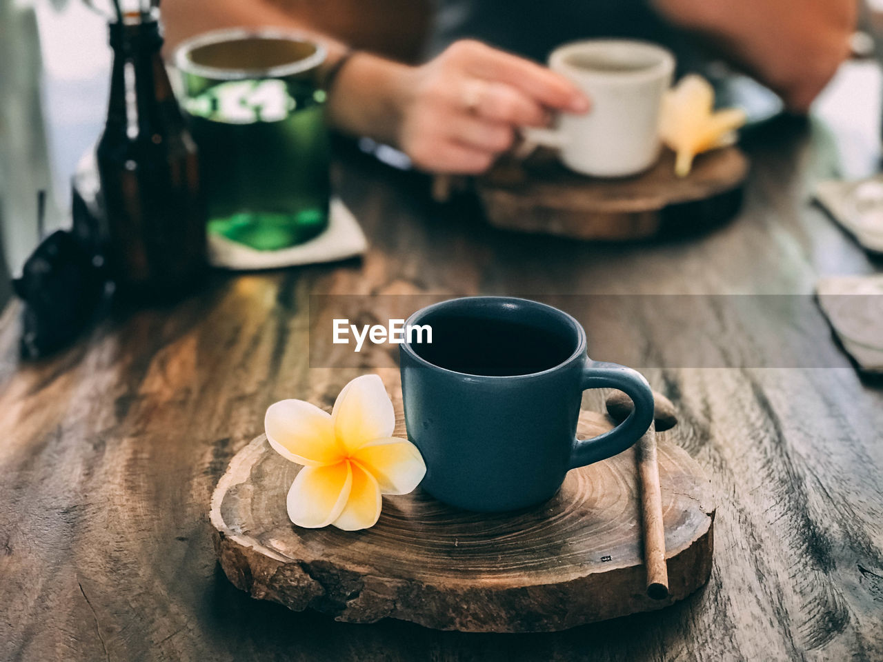 CLOSE-UP OF COFFEE CUP ON TABLE AT HOME