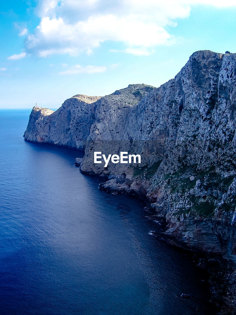 Scenic view of sea against blue sky