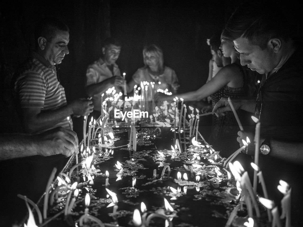 GROUP OF PEOPLE IN GLASS