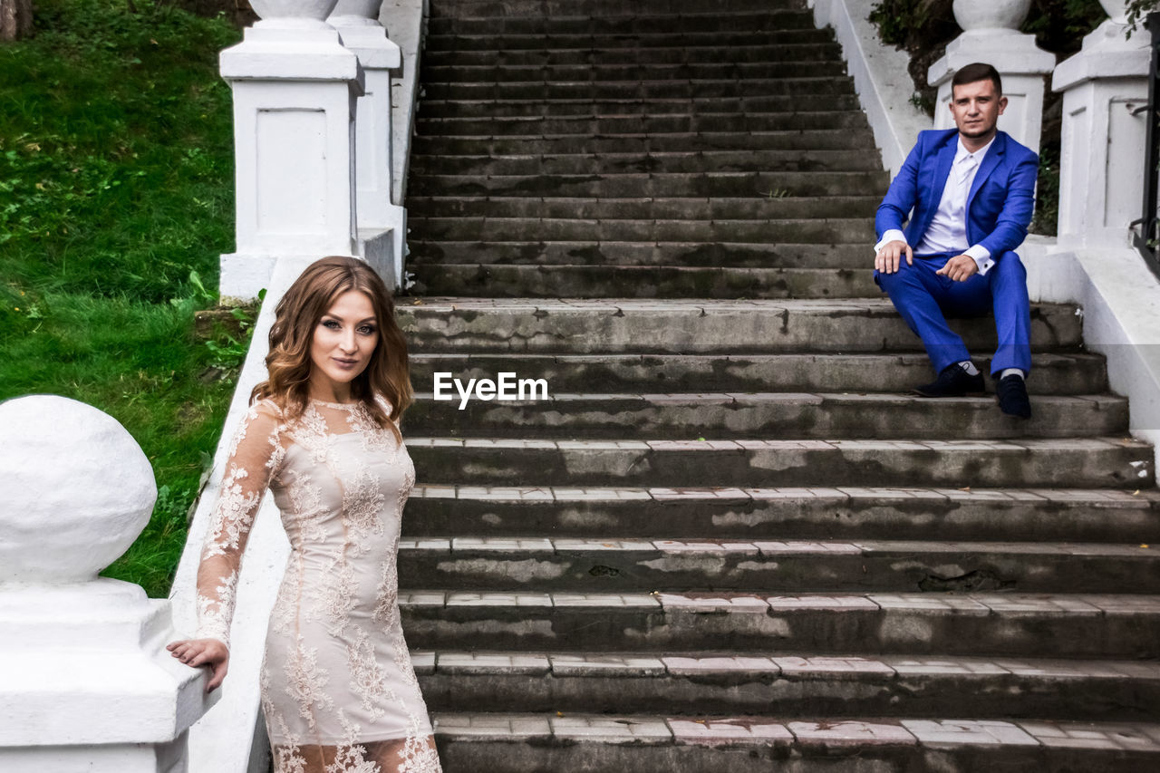 Portrait of couple on staircase