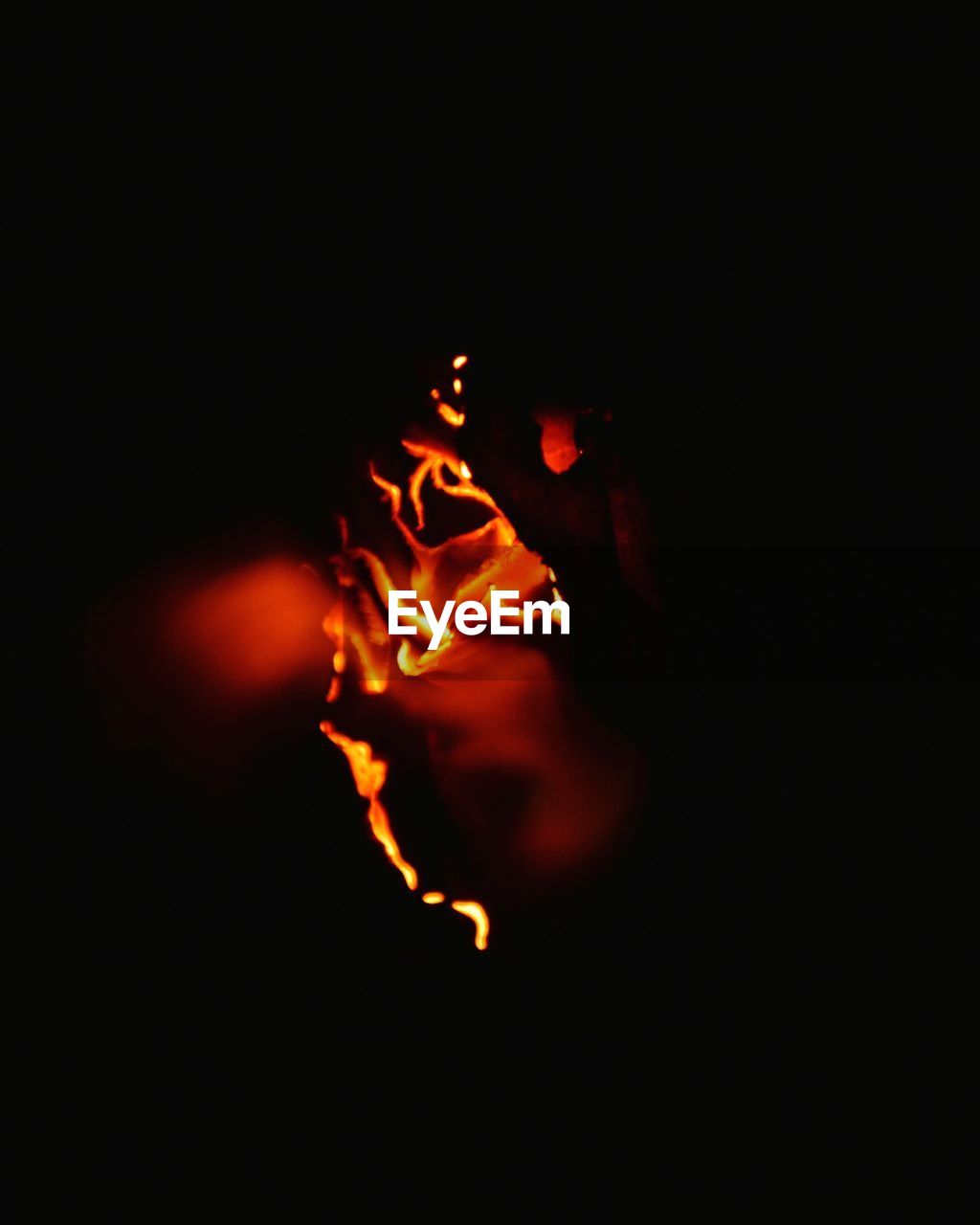 CLOSE-UP OF FIRE OVER BLACK BACKGROUND