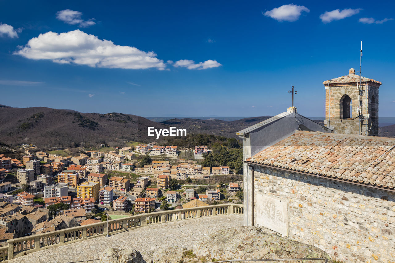high angle view of buildings in city against sky