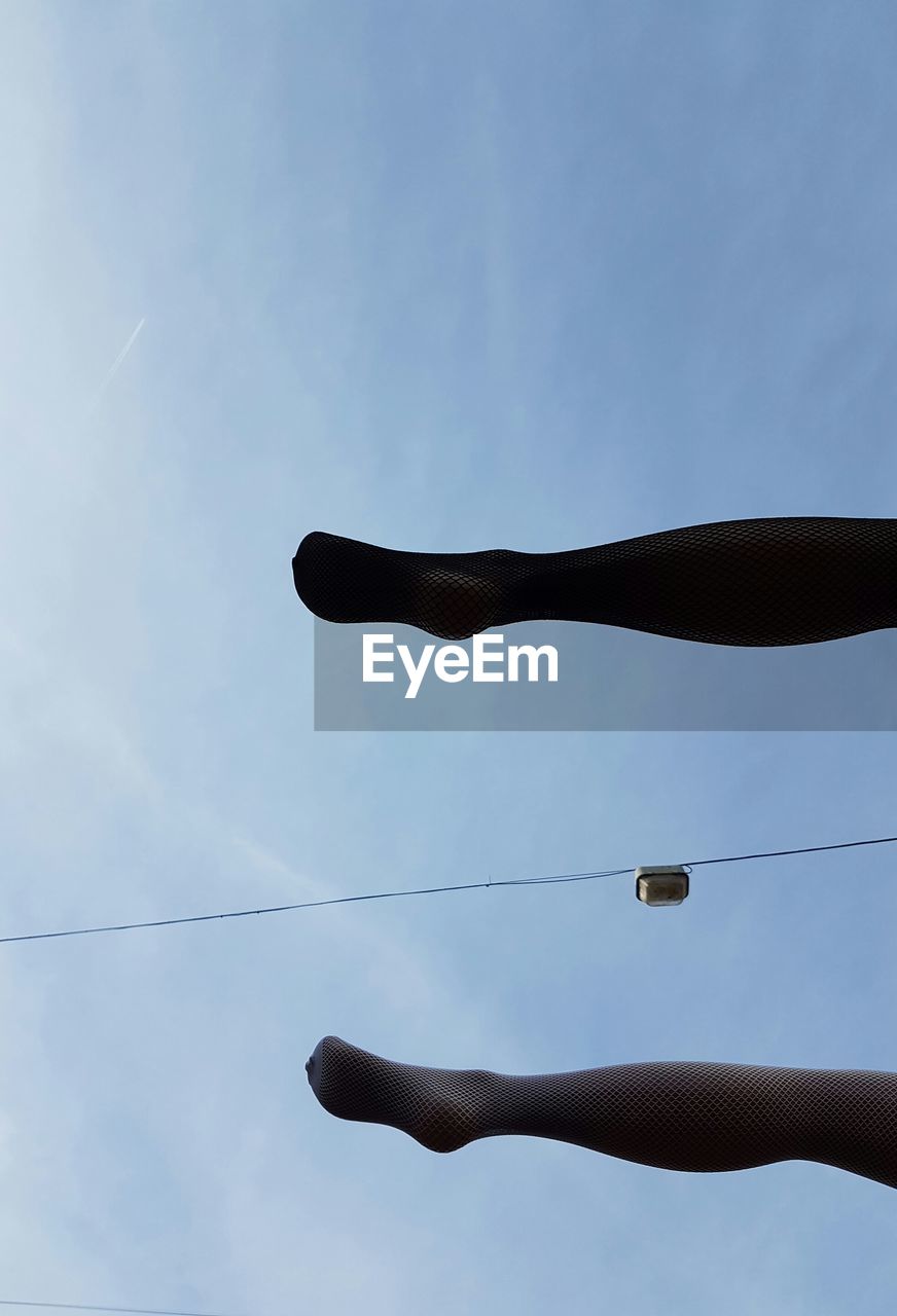 LOW ANGLE VIEW OF TELEPHONE POLE AGAINST SKY