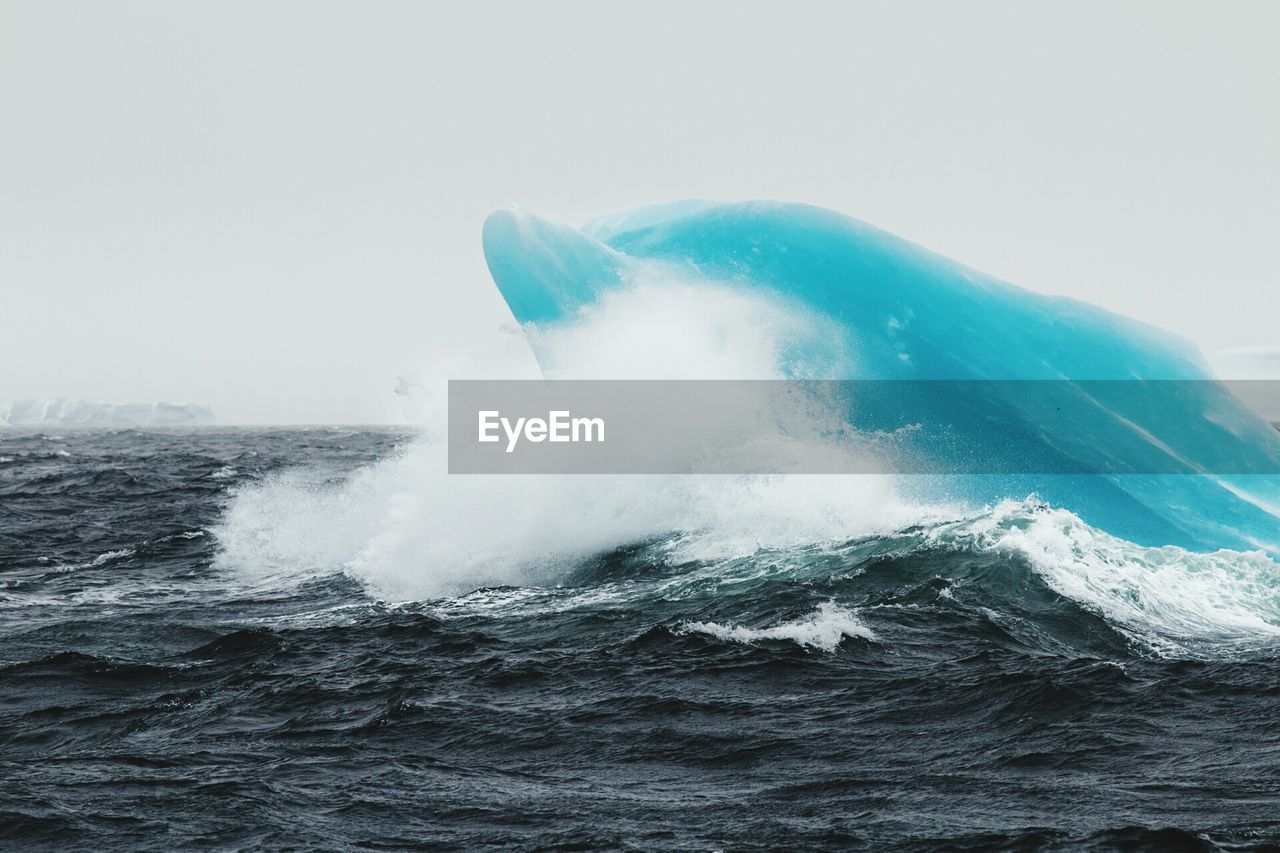 WAVES SPLASHING ON ROCKS