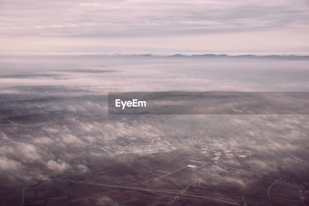 Aerial view of landscape against sky during sunset