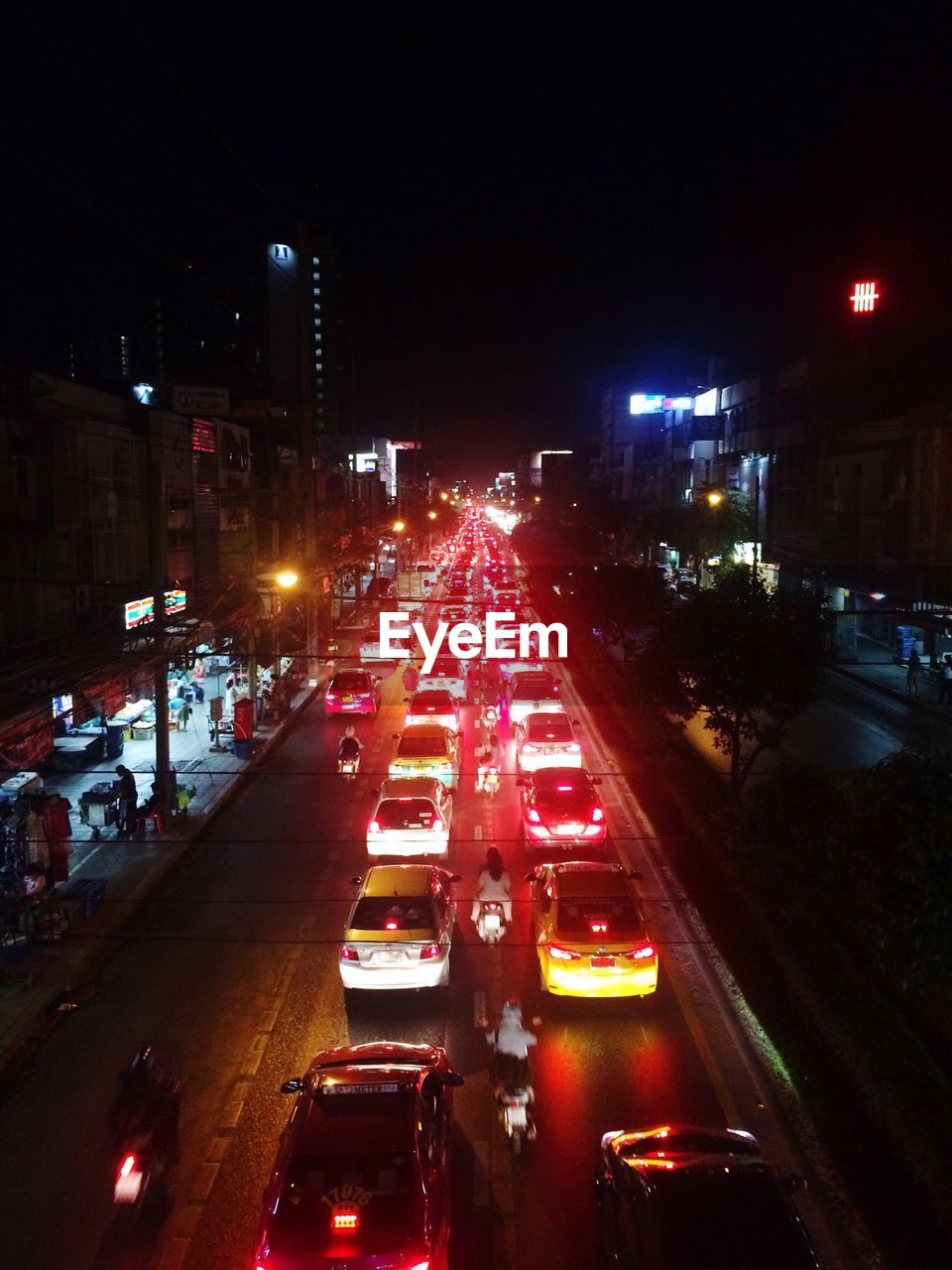 High angle view of cars on illuminated street at night