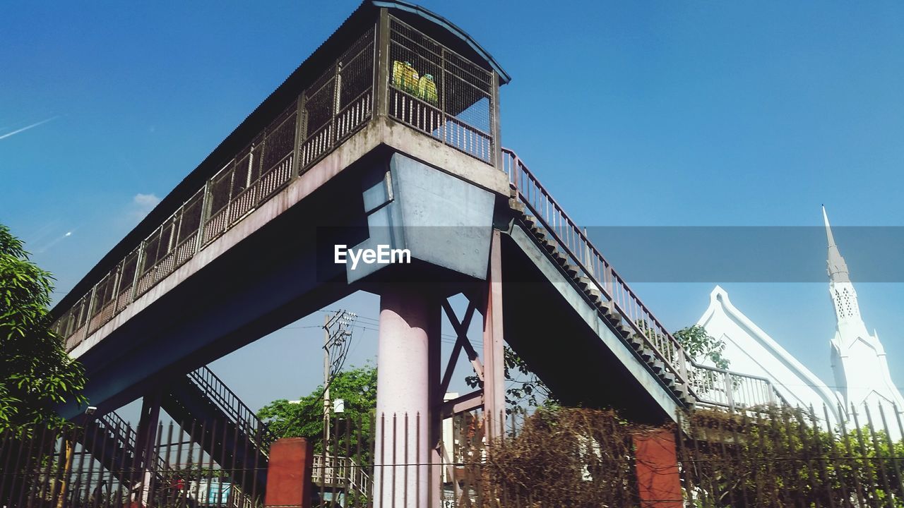 LOW ANGLE VIEW OF BUILT STRUCTURES AGAINST SKY