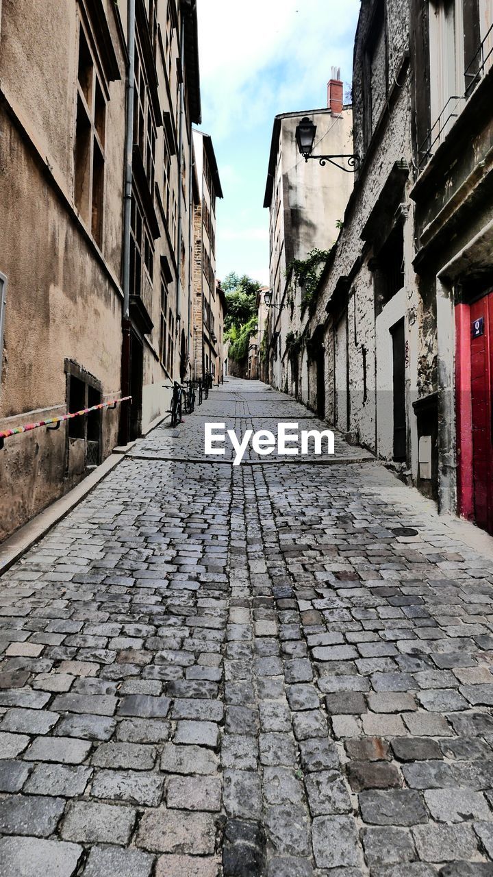 Alley amidst buildings in town