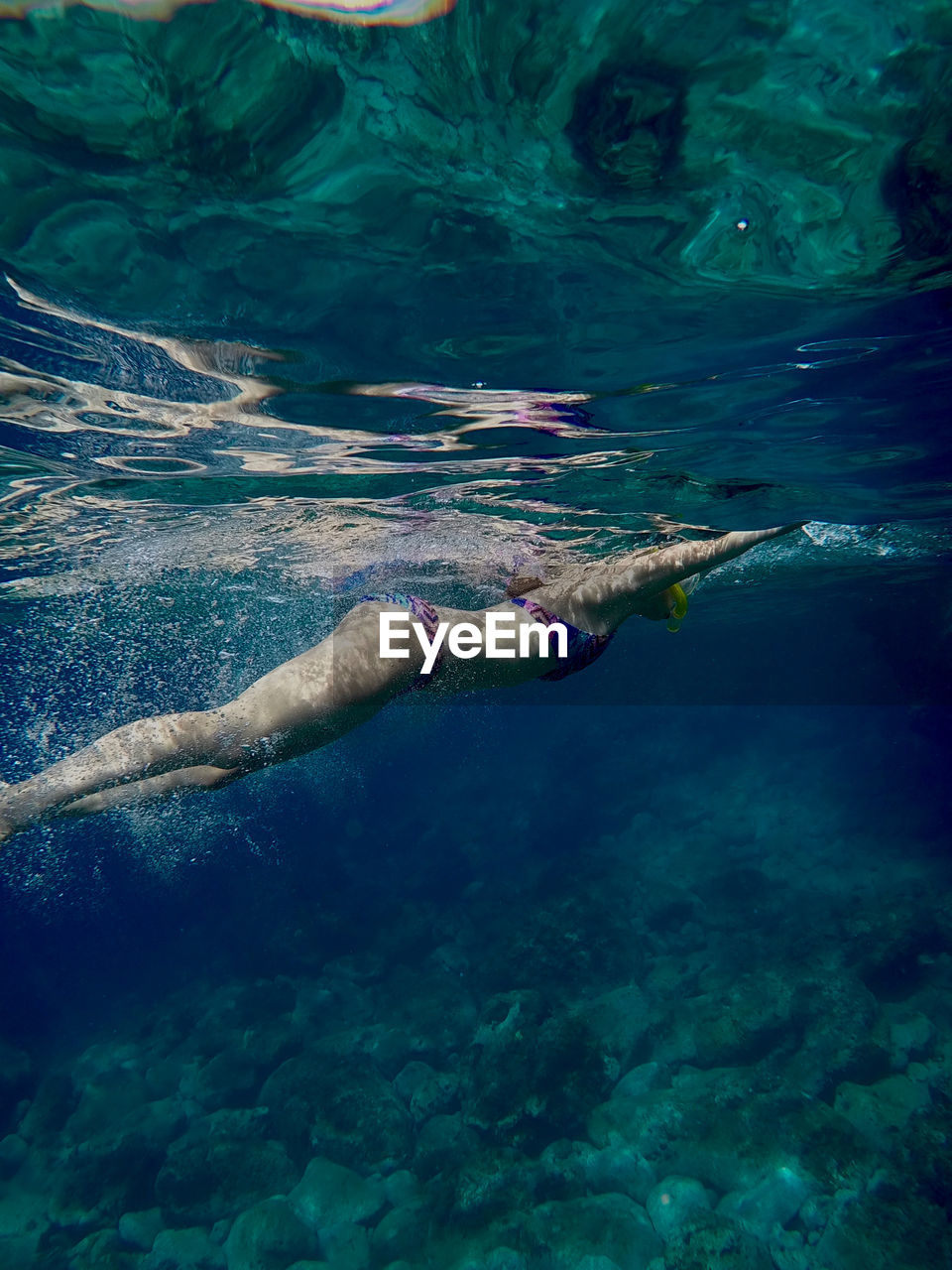 High angle view of girl swimming in sea