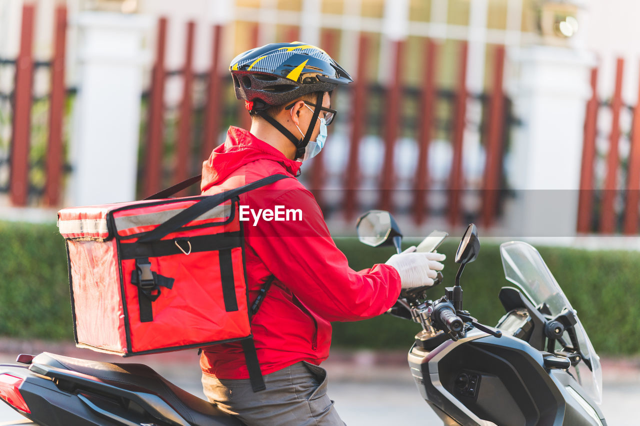 MIDSECTION OF MAN RIDING BICYCLE