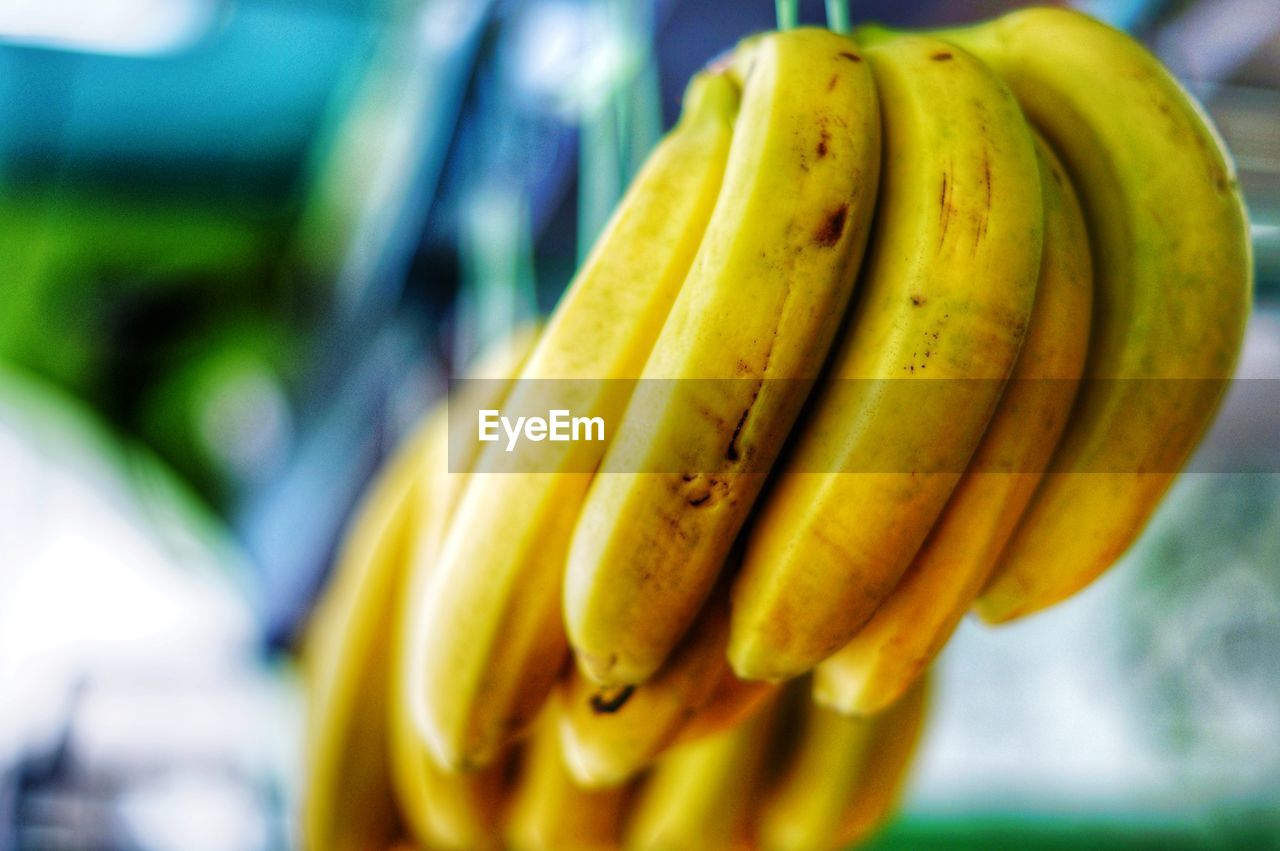 CLOSE-UP OF BANANAS FOR SALE IN MARKET STALL