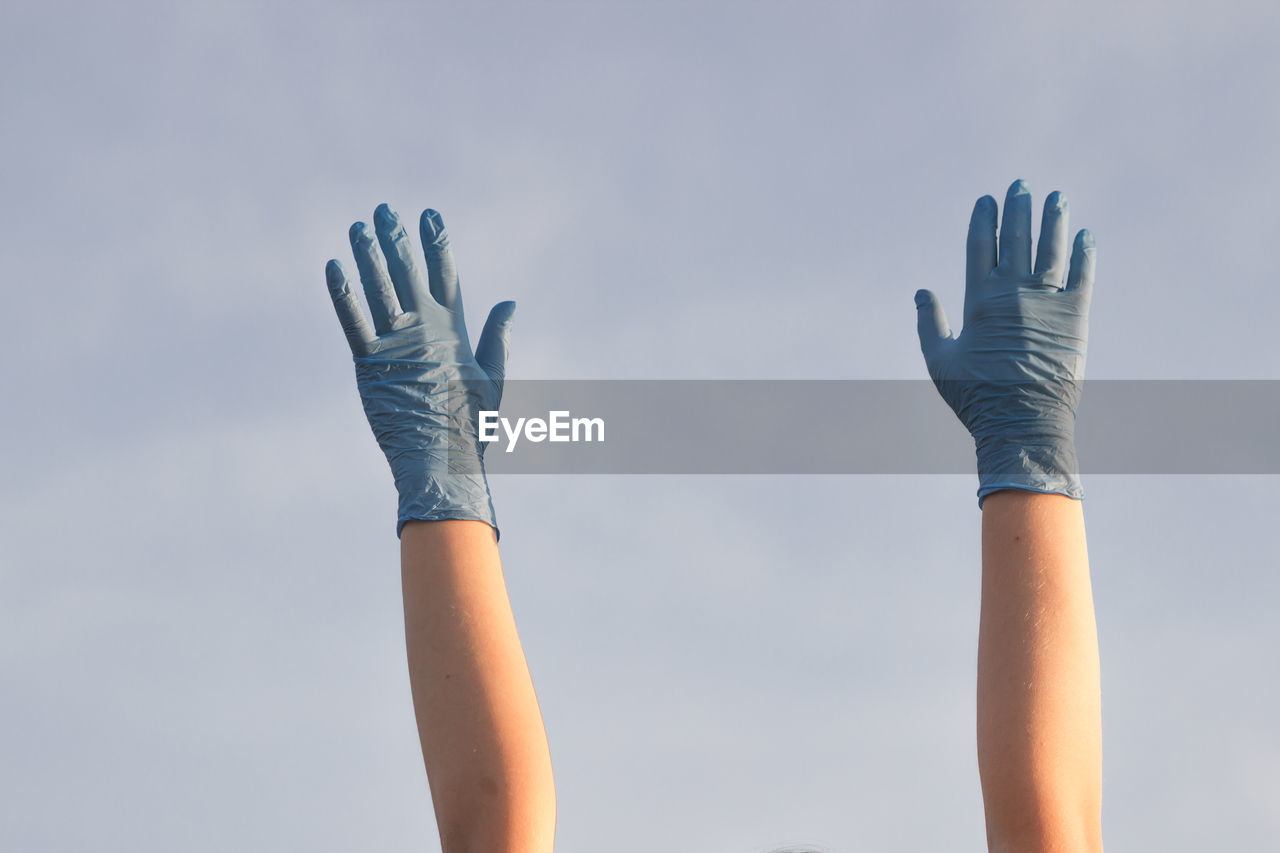 glove, blue, hand, sky, finger, nature, one person, arm, adult, human limb, women, limb, cloud, outdoors, lifestyles, day