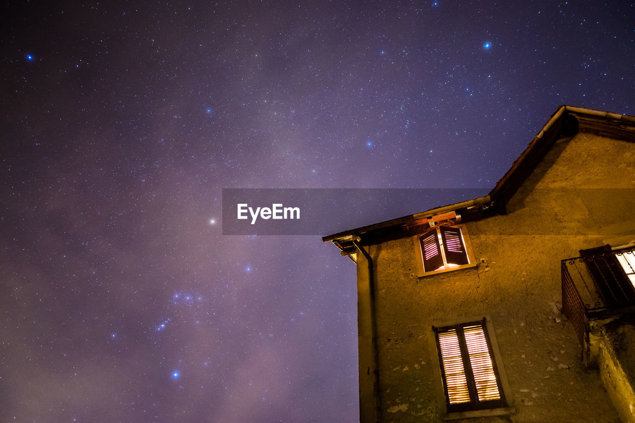 Low angle view of building against sky at night