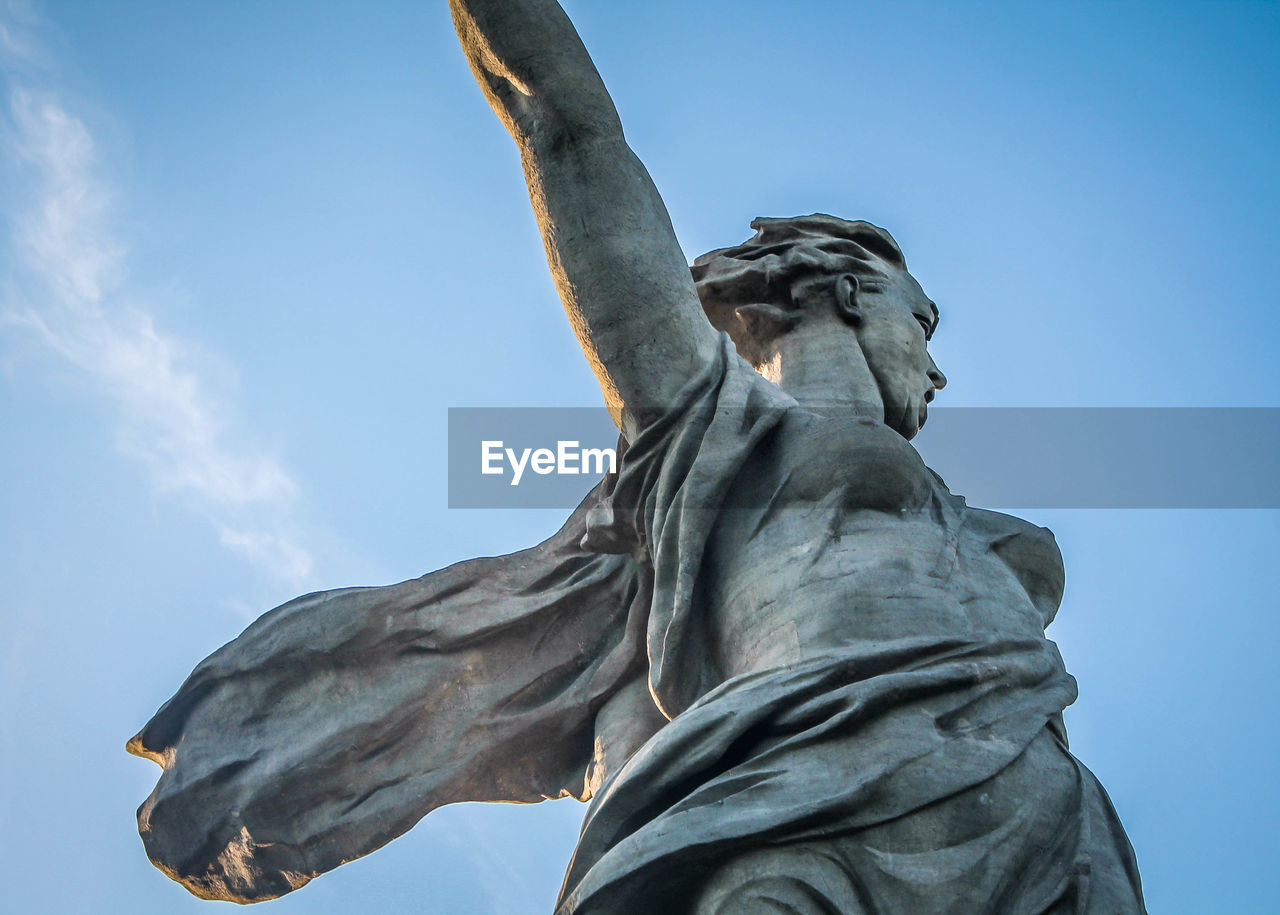 Low angle view of statue against sky