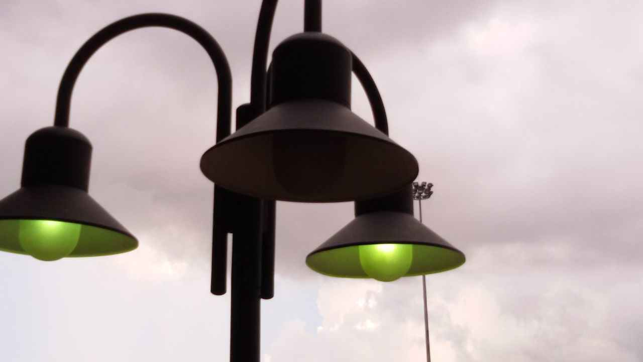 Close-up of street lamp against sky