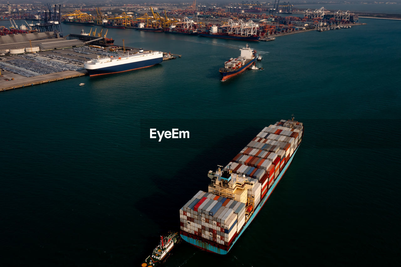 Aerial view container cargo ship carrying commercial container in import export business 