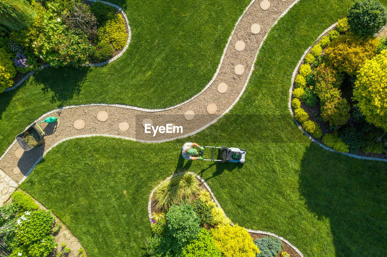 Directly above shot of man using lawn mower