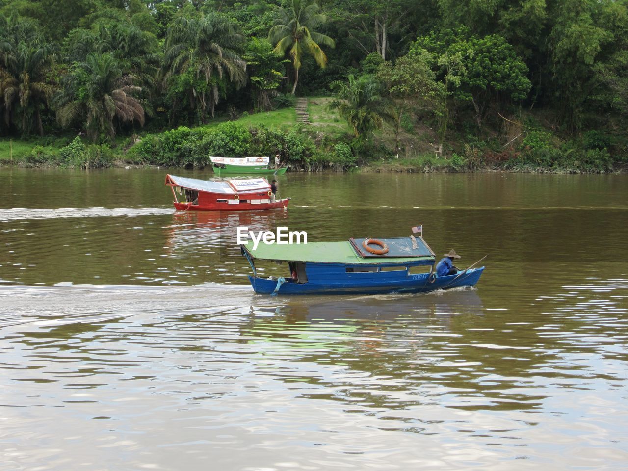 BOATS MOORED IN LAKE