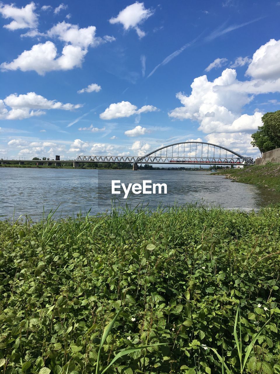 Bridge over river against sky