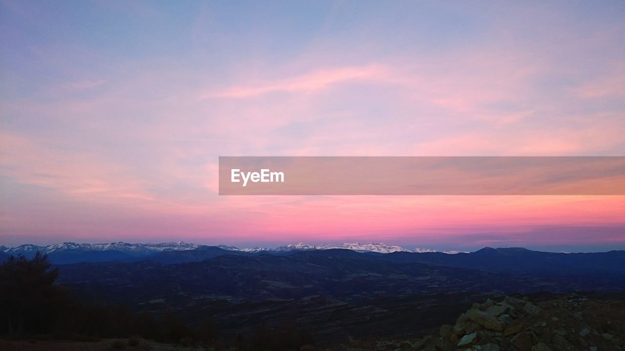 Scenic view of dramatic sky during sunset